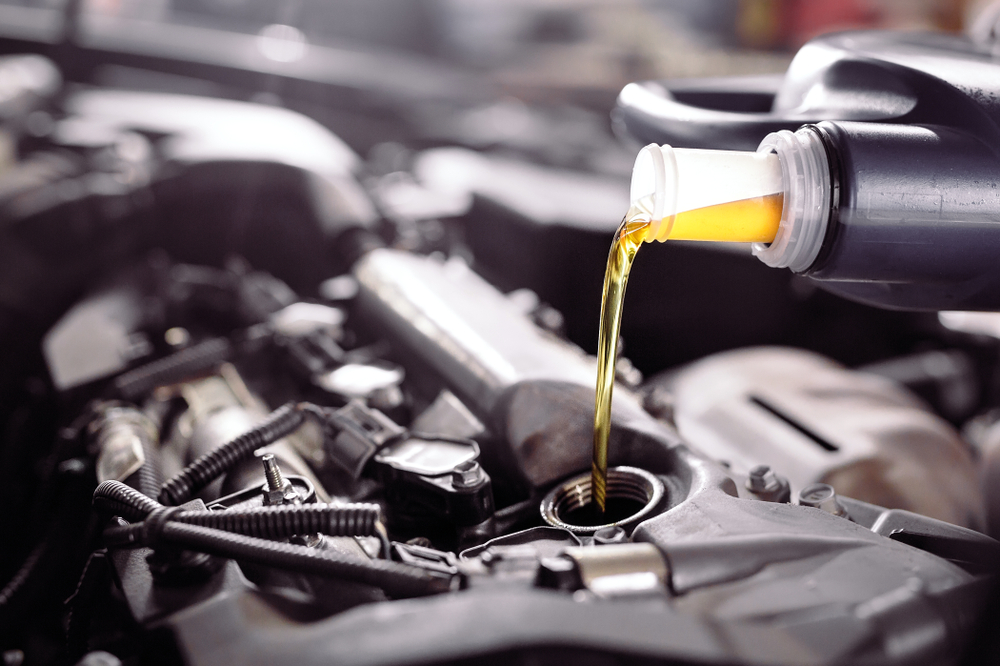 Image of motor oil being poured into an engine